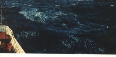 Beaufort force 7: heaped sea with breaking crests and wind-blown foam.